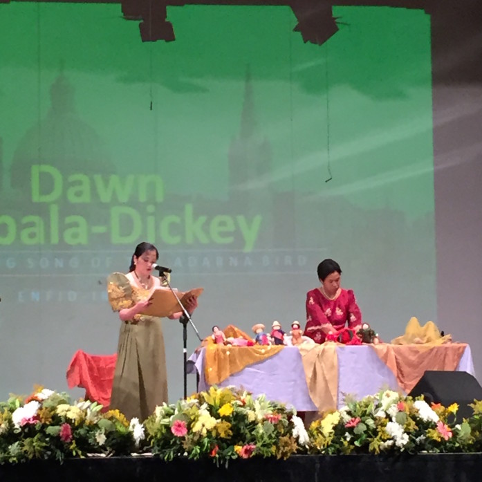 Dawn Zabala Dickey and Vanda Macion-Brady performing a puppet show presentation of The Healing Song of the Adarna Bird